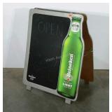 Advertising chalkboard with Heineken beer. Two