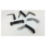 Pocket knives and a sharpener