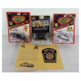 Police die cast cars, still in packaging and a