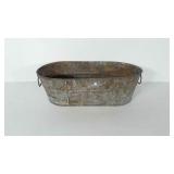 Galvanized tub, marked CUBASA 00 on the bottom.