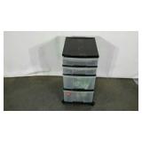 Plastic storage cart, 4 drawers, includes some