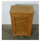 Oak, tilt-out trash can holder. Needs cleaning.