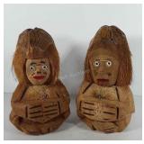 Two hand-carved coconut monkey coin banks, about