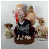 Five porcelain dolls, includes clown, grandma
