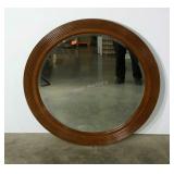 Large round framed mirror with beveled glass. 42"