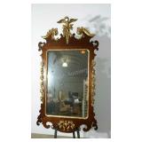 Intricate mirror with gilded accents. Eagle shows
