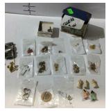 Tin of jewelry, earrings, figurines, pendants etc