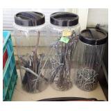 3 plastic canisters of hardware and hooks