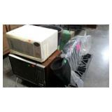 Skid lot: three older microwaves, suitcase,