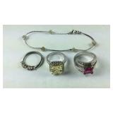 Three Silverplate rings and a silvertone bracelet