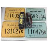 Two pocket knives and four NY hunting tags