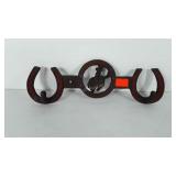 Cast iron, equestrian/western style wall hanging