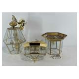 Three brass and beveled glass light fixtures,