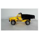 Metal Tonka truck with plastic trim. Measures 14