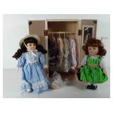 Two porcelain dolls with closet, four outfits and