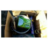 Skid lot: microwave, luggage, garbage can,