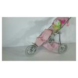 Doll stroller with fuzzy rainbow dog