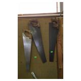 Three carpenters hand saws