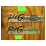 Two auto emblems, P,G, Chevrolet,