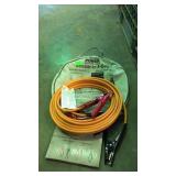Set of jumper cables in storage pouch