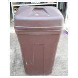 Brown trash can with lid and on wheels