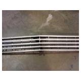 1960s Chevy Nova grill with hood latch bracket