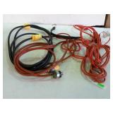 A group of three extension cords the various