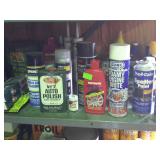 Shelf lot of chemicals that include auto paint