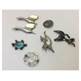 Group of seven Sterling broaches