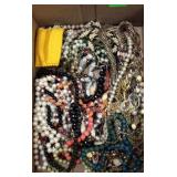 Flat of costume jewelry