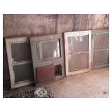 Group of four wood framed house windows, 2 pane