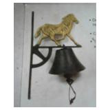 Three cast iron horse bells new in boxes, wall