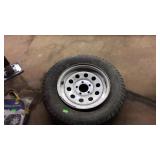 Trailer tire with 5 lug wheel, tire is broke from