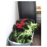 Large storage tote with Christmas garland,