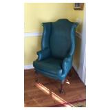 Green Naugahyde wing back chair does have some