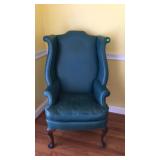 Green Naugahyde wing back chair