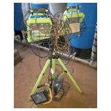 One double lamp flood light on adjustable tri-pod