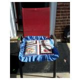 Red mesh, metal framed patio chair with pillow