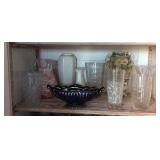 Shelf contents of planters, vases, painted