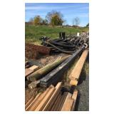 Group of rough cut poplar boards 16ft long and 5