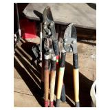 Three sets of tree limb loppers prunners