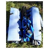 Two blue Kelysyus folding chairs