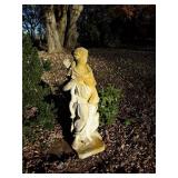 Concrete statue of lady archer with dog