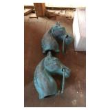 Two cast iron horse head hitching posts in box