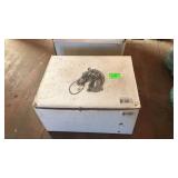 Two cast iron horse head hitching posts in box