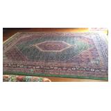 Room rug wool with green border and diamond