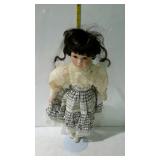 19" doll in brown and cream colored dress,