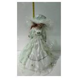 17" umbrella base doll with porcelain head in