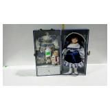 Heritage Mint 12" porcelain doll with teddy bear,