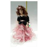 20" porcelain doll in green velour topped rose